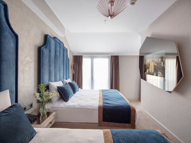 Delüks Üç Kişilik Oda