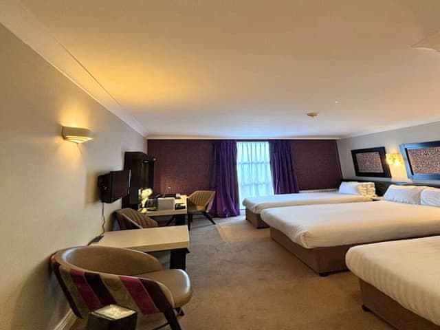 Quad Room – One Double and Two Single Beds