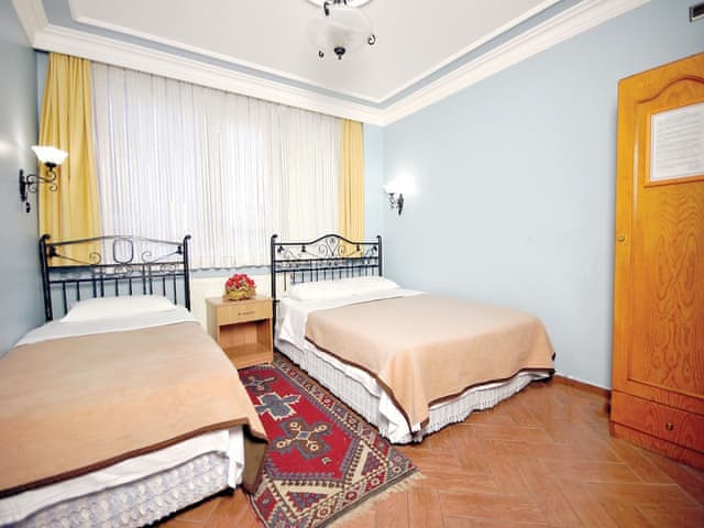 Ekonomik Üç Kişilik Oda