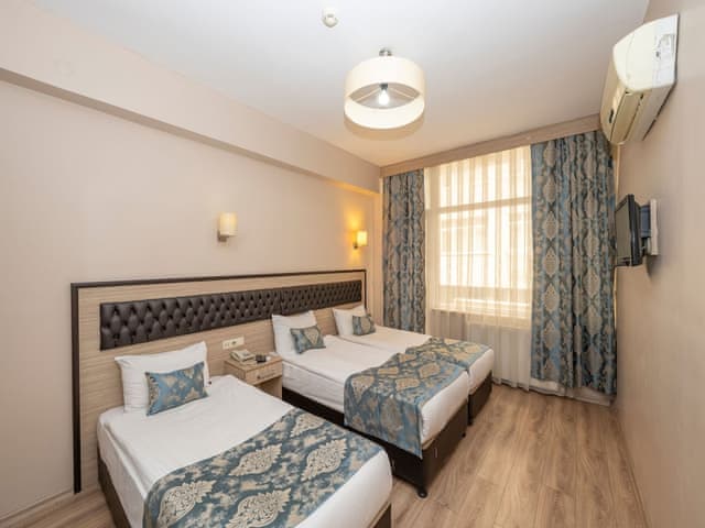 Delüks Üç Kişilik Oda