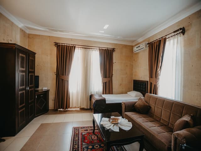Deluxe Triple Stone Room with Private Balcony