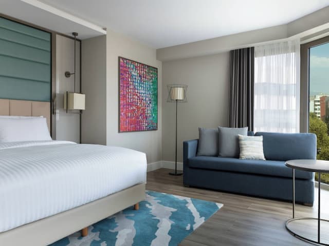 Family Room, 1 King Bed with Sofa bed, Partial Sea View (Corner)